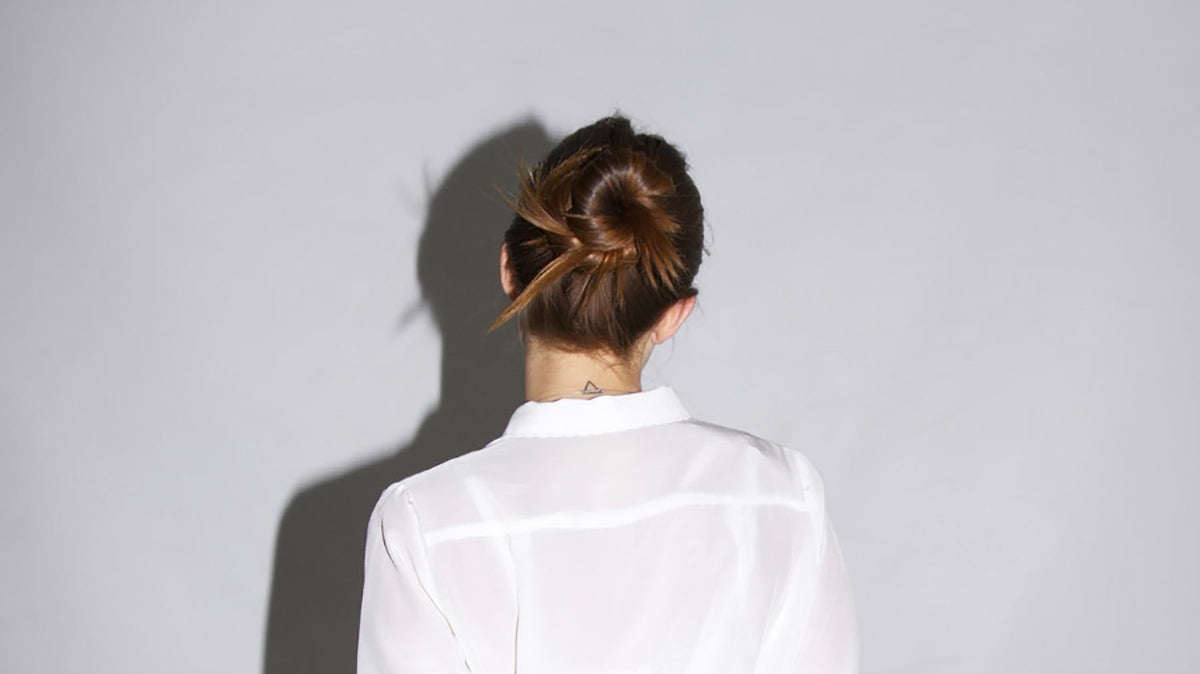 girl with bun for winter using neuma products